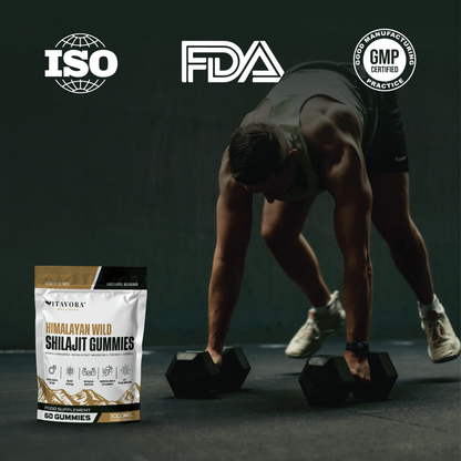 An athletic high-performing male trainer training with dumbbells next to the Vitavora Wellness Himalayan Wild Shilajit Gummies pouch and official ISO, FDA, and GMP certified manufacturing stamps.